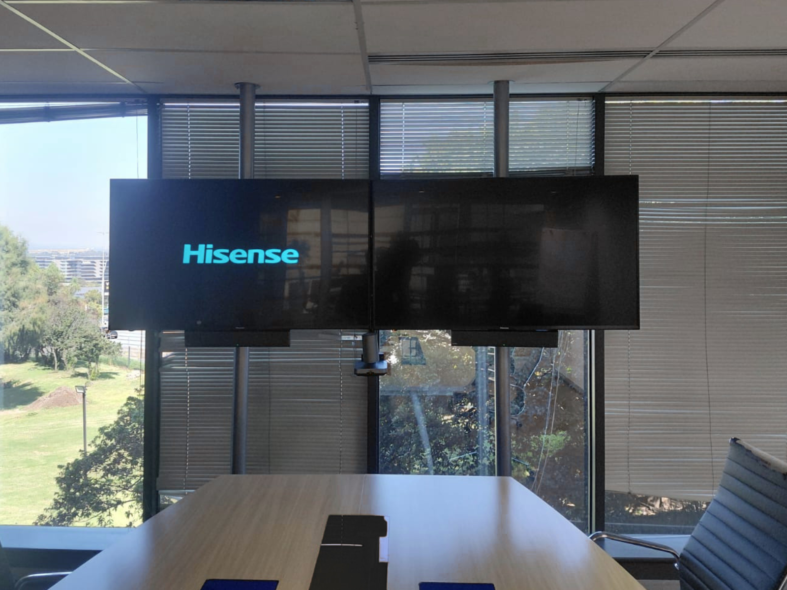 Masiso Solutions meeting room with dual displays and video conferencing